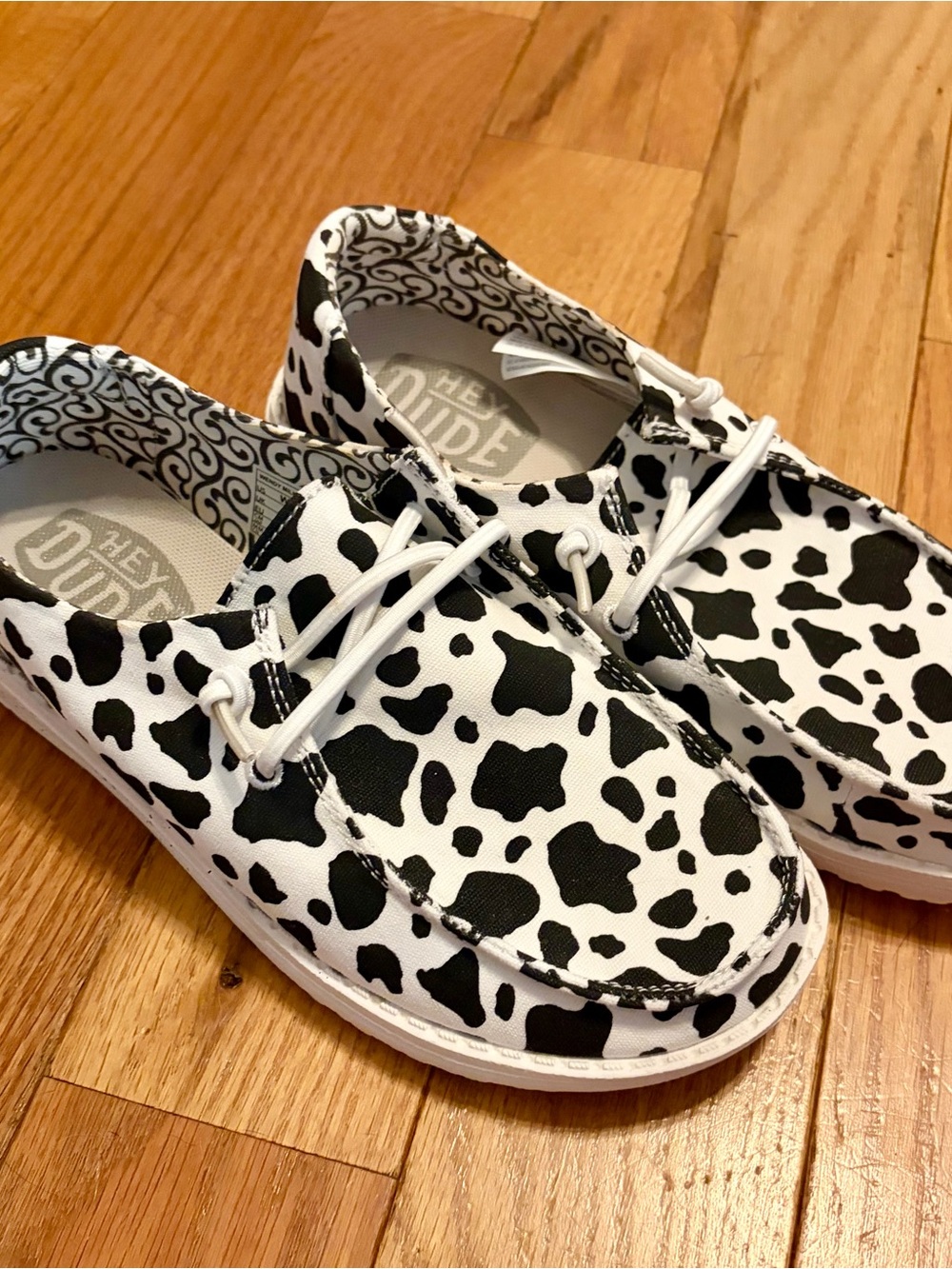 Hey Dude Kids Cow Spot Slip-Ons in Black & White